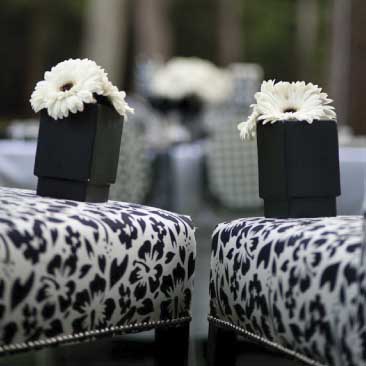 Black and White detail of upholstered chairs and flowerpots from an outdoor wine tasting event, Boston Event Planner, Boston Event Planning, Boston Event Stylist, Boston Event Styling