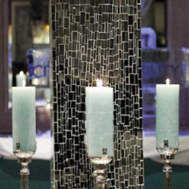 Blue detail of mirrored column surrounded by pillar candles for a corporate holiday event, Boston Event Planner, Boston Event Planning, Boston Event Stylist, Boston Event Styling