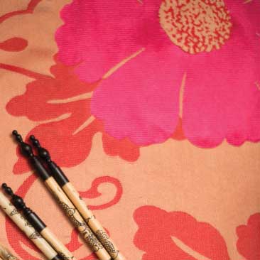 Pink detail of floral tablecloth and chopsticks from a Vietnamese engagement party; Boston Event Planner, Boston Event Planning, Boston Event Stylist, Boston Event Styling