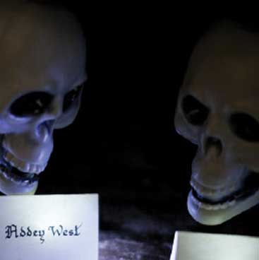 Purple detail of skulls and table name cards from a scary Halloween dinner party; Boston Event Planner, Boston Event Planning, Boston Event Stylist, Boston Event Styling