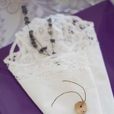 Purple detail of lace napkin folded around a green sprig from a wine tasting bridal shower; Boston Event Planner, Boston Event Planning, Boston Event Stylist, Boston Event Styling