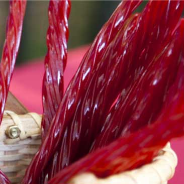 Red detail of licorice sticks from a Fourth of July celebration; Boston Event Planner, Boston Event Planning, Boston Event Stylist, Boston Event Styling