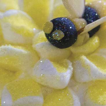 Yellow detail of sugar bee on a yellow sugared flower made of marshmallow from a Harvard graduation celebration; Boston Event Planner, Boston Event Planning, Boston Event Stylist, Boston Event Styling