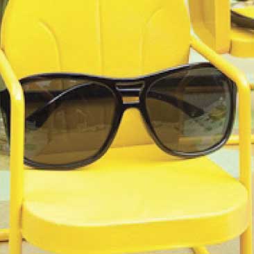 Yellow detail of mini metal lawn chairs holding a pair of sunglasses from a backyard birthday pool party; Boston Event Planner, Boston Event Planning, Boston Event Stylist, Boston Event Styling