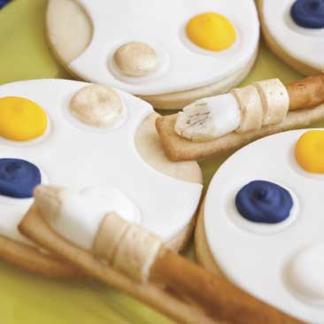 Yellow detail of sugar cookies iced to look like paint palettes from a Van Gogh High Tea events; Boston Event Planner, Boston Event Planning, Boston Event Stylist, Boston Event Styling